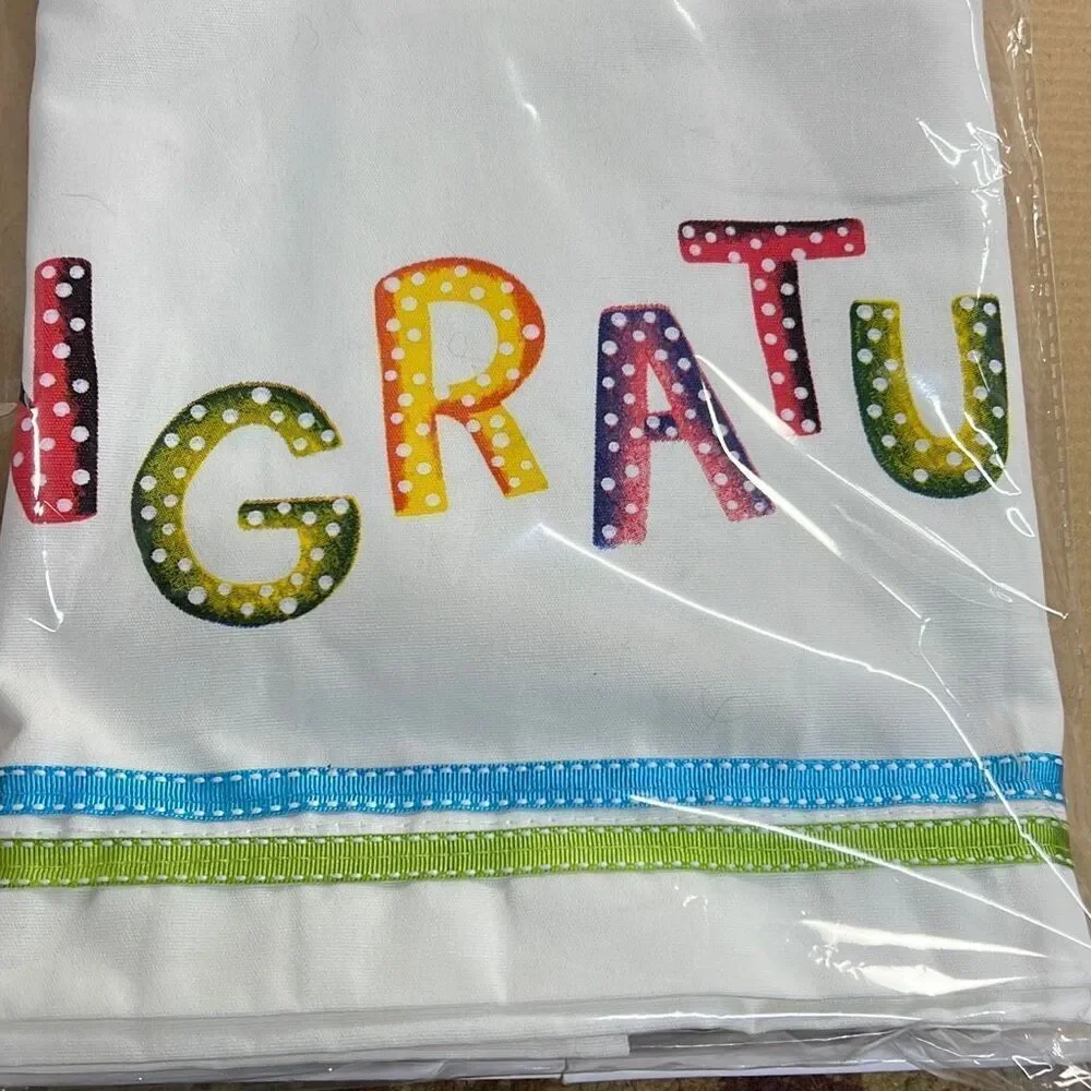 Congratulations table drape write on 28” x 80” never opened colorful print on wh